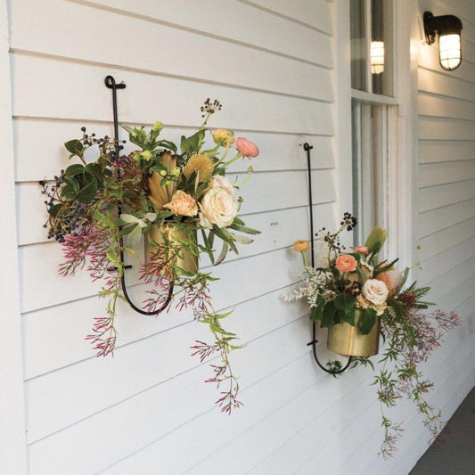 a couple of vases that are on a wall