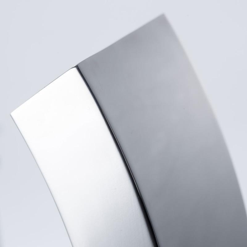 a close up of a metal object on a white surface