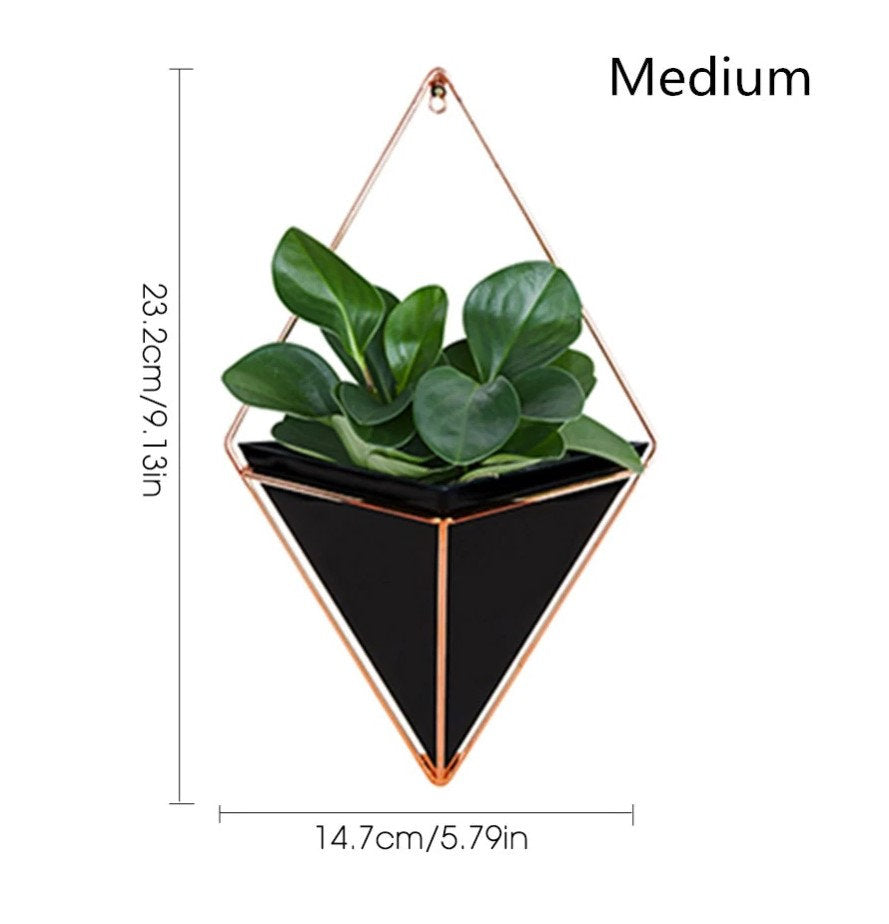 a planter hanging on a wall with the measurements