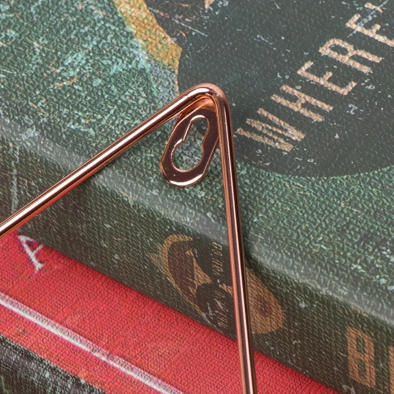 a close up of a metal object on top of a book