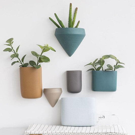 a wall mounted planter on a white wall